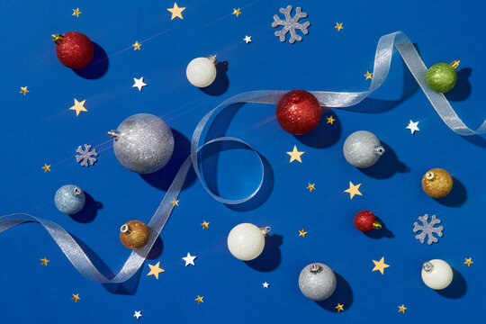 Flat lay pattern with Christmas balls and snowflakes