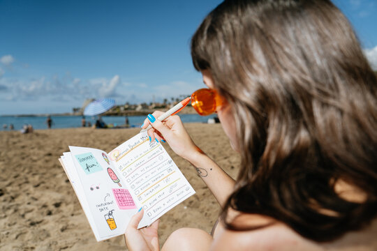 Woman Writing a Whishlist