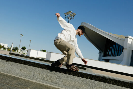 A man roller skates in the city