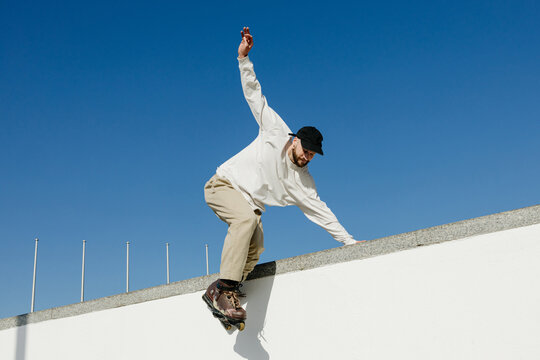 A man roller skates in the city