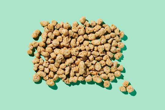 bunch of soya chunks on a green background