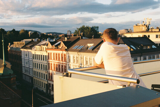 Anonymous man on a terrace on sunset