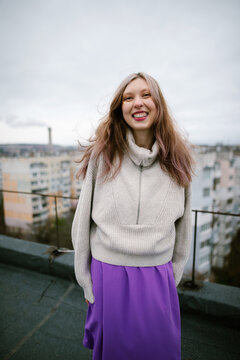 Portrait Of A Smiling Woman With Makeup On The Rooftop 