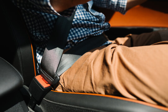 A man buckled up in the car