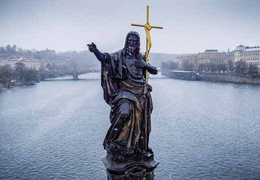 Statue of St. John the Baptist in snow