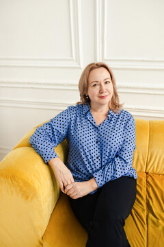 Self-confident middle-age woman looking at the camera 
