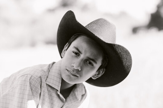 Teen Boy on Cowboy had. BW