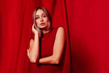 Fair haired lady in trendy dress in studio