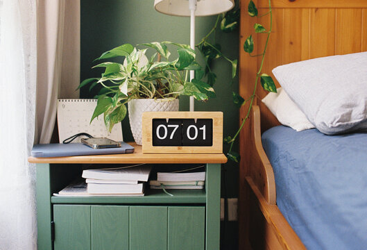 Bedroom with a wooden alarm clock