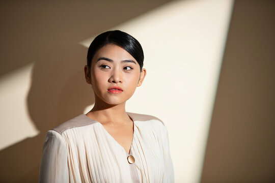 Confident young businesswoman in suit, look determined
