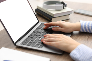 E-learning. Woman using laptop during online lesson indoors, closeup