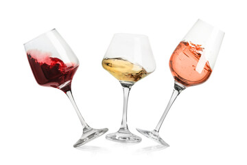 Different types of wine splashing in glasses on white background