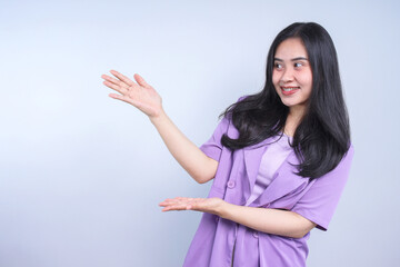 Smiling Young Woman Gesture Hand Presenting To Copy Space for Advertisement 