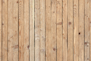 A wooden background with a few small holes in it