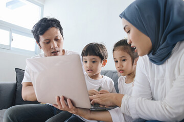 Parents Teaching Kids Using Laptop. Fun Learning at Home. 