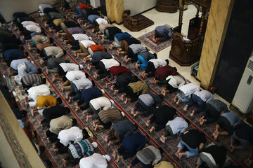 Muslim People Praying Salah Doing Prostration Together at Mosque, Follow Imam as Leader. 