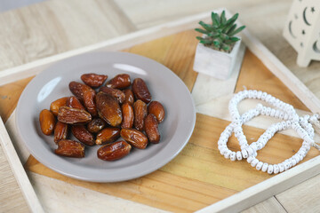 Dates Fruit on Wooden Tray with Ramadan Festive Ornament