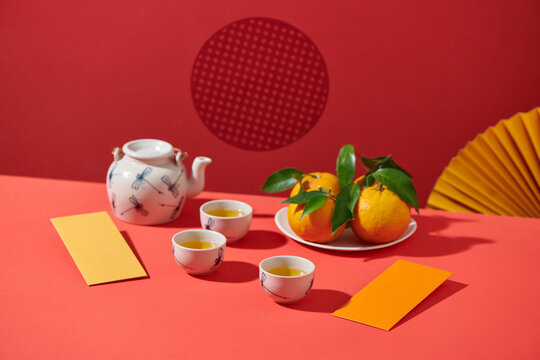 Lunar new year holiday with mandarin orange, teapot and envelope