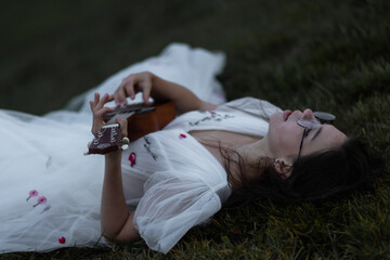 A Caucasian bride in a wedding dress plays the Ukulele - a Hawaiian four-stringed guitar variety...