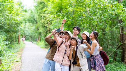 Group of Young Asian man and woman friends travel nature on summer holiday vacation. Happy people...