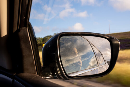 Woman Taking Photos In The Rear View Mirror