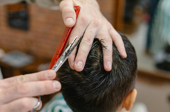 child's haircut at the barbershop