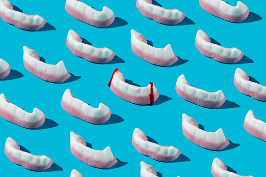 pattern of sweet fangs, one of them with blood