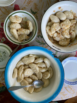 Bowls with just made dumplings on the table