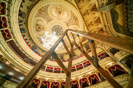 Wooden stepladder for cleaning in a beautiful classical theater hall