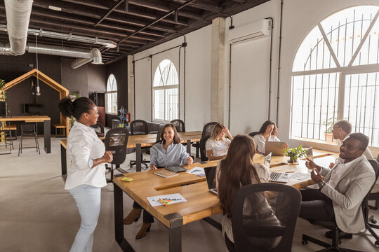 group leader with her employees in a coworking office