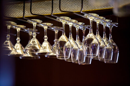 Bar and wine glasses hanging at bar ready to celebrate