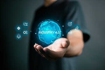Smart factory automation and industry 4.0 concept. Smart industrial revolution, automation, robot assistants, iot, cloud and big data. Person connected industry 4.0 on virtual screen.