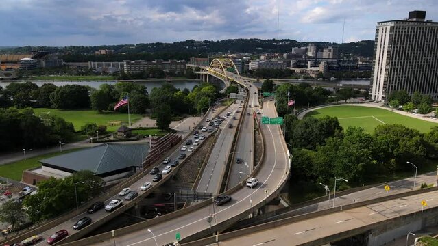 PITTSBURGH - 1.22.2024 - Excellent aerial footage moving along highway traffic that feeds into the Fort Duquesne Bridge in Pittsburgh, Pennsylvania.