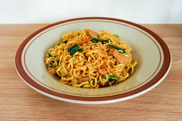 Indonesian fried noodle in a plate, ready to eat