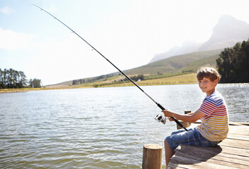 Happy child, portrait and fishing by lake or nature for outdoor adventure, learning and...
