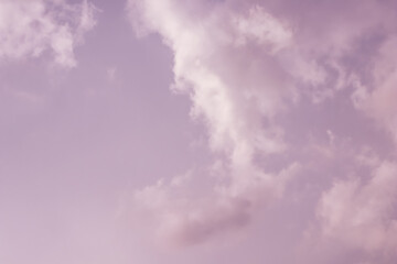 Background of a beautiful pink and pale purple sky with clouds at sunset