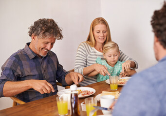 Couple, child and home for breakfast with guest on happiness in morning for bonding with conversation, support and care. Family, parents and meal to eat with coffee, table and enjoy together.