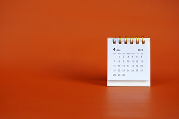 April 2024. April 2024 month calendar on soft red background
