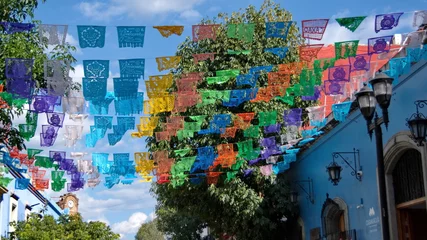 Fotobehang Colorful Day of the Dead flags hanging above the street in Oaxaca, Mexico © Angela