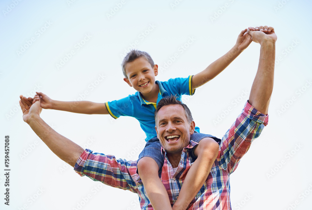 Wall mural Dad, young boy and shoulders of parent, sky and outdoors in park with smile. Laugh, love and bonding with son and father with family, spring and carrying child in summer and spending time together