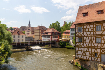 Obraz premium Panorama with bridge over river Regnitz with half-timbered house and St. Stephans church in Bamberg, Upper Franconia, Bavaria, Germany