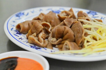 Photo of Lu Dachang, a savory Taiwanese braised intestine, is popular as a snack or homey dish. Ginger, sweet chili sauce, and soy sauce paste add a delicious sweet-salty flavor.