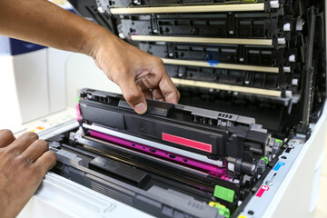 Technician open cover printer fix repair problem and replace drum and ink cartridges and for print scanning fax or copy document or photocopier or photocopy in office workplace service support concept