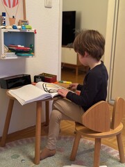 child at the desk