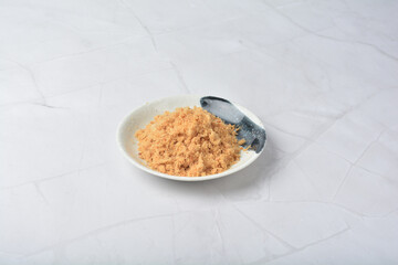 homemade chicken pork fish floss asian dry slices meat product in round plate on white marble table ingredient cafe restaurant food japan vegan halal snack festive menu