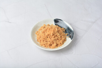 homemade chicken pork fish floss asian dry slices meat product in round plate on white marble table ingredient cafe restaurant food japan vegan halal snack festive menu