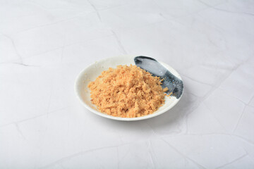 homemade chicken pork fish floss asian dry slices meat product in round plate on white marble table ingredient cafe restaurant food japan vegan halal snack festive menu