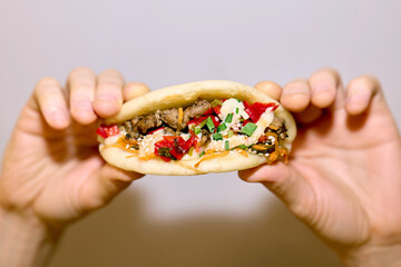 Anonymous hands holding bao bun