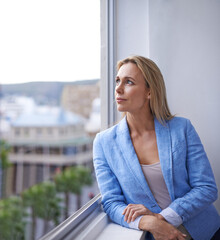 Thinking, window and business woman in office with idea, brainstorming project or planning. Professional worker, city view and thoughtful person for strategy, problem solving or solution in workplace