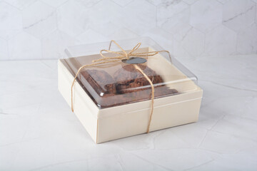 gourmet freshly bake golden Texas sweet chocolate chip honey biscuit cake scone milk butter bread in square bento wood box on white marble table rose gold fork knife pastry halal dessert vegan menu